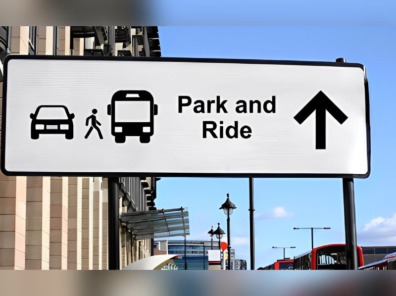 A sign that says park and ride with an arrow pointing to the right.
